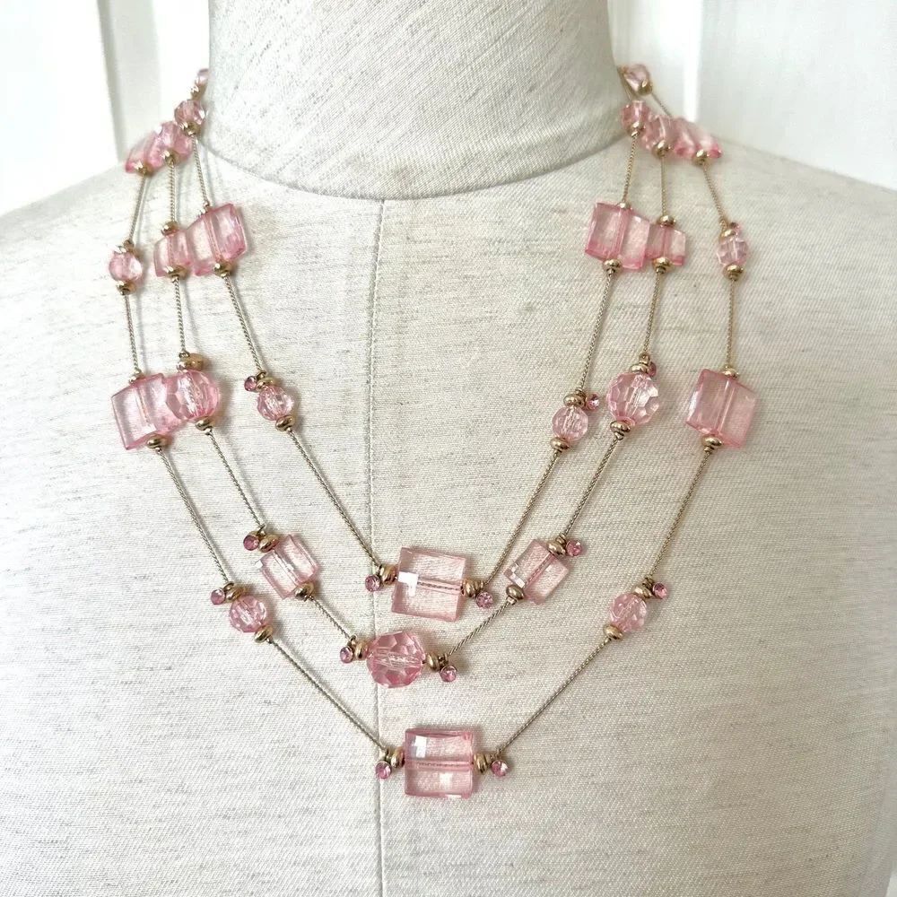 Pink beaded gold tone multi strand necklace